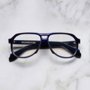An image of the 9782 Aviator Optical in Classic Navy Blue frame frontal view with arms closed marble background