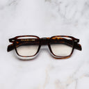 An image of the GR07 Square Optical Glasses in Dark Turtle frame frontal view with arms closed marble background 