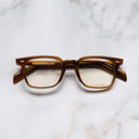 An image of the GR10 Square Optical Glasses in Saffron Horn frame frontal view with arms closed marble background
