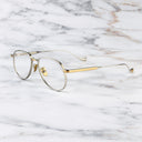 An image of the Pembroke 1429 Aviator Opticals in Silver/Gold frame side view with arms open marble background