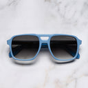 An image of the 1394 Aviator Sunglasses in Solid Light Blue frame frontal view with arms closed marble background