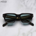 An image of the 1432 Square Sunglasses in Black frame frontal view with arms closed marble background