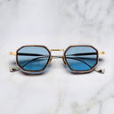 An image of the Cutler and Gross Carlyle 1437 in Antique Silver/Gold/Havana  frame frontal view with arms closed marble background.