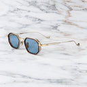 An image of the Cutler and Gross Carlyle 1437 in Antique Silver/Gold/Havana  frame side view with arms open marble background.