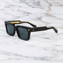 An image of the 9386 Square Sunglasses in Black frame side view with arms open marble background