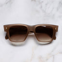 An image of the 9690 Square Sunglasses in Humble Potato frame frontal view with arms closed marble background 
