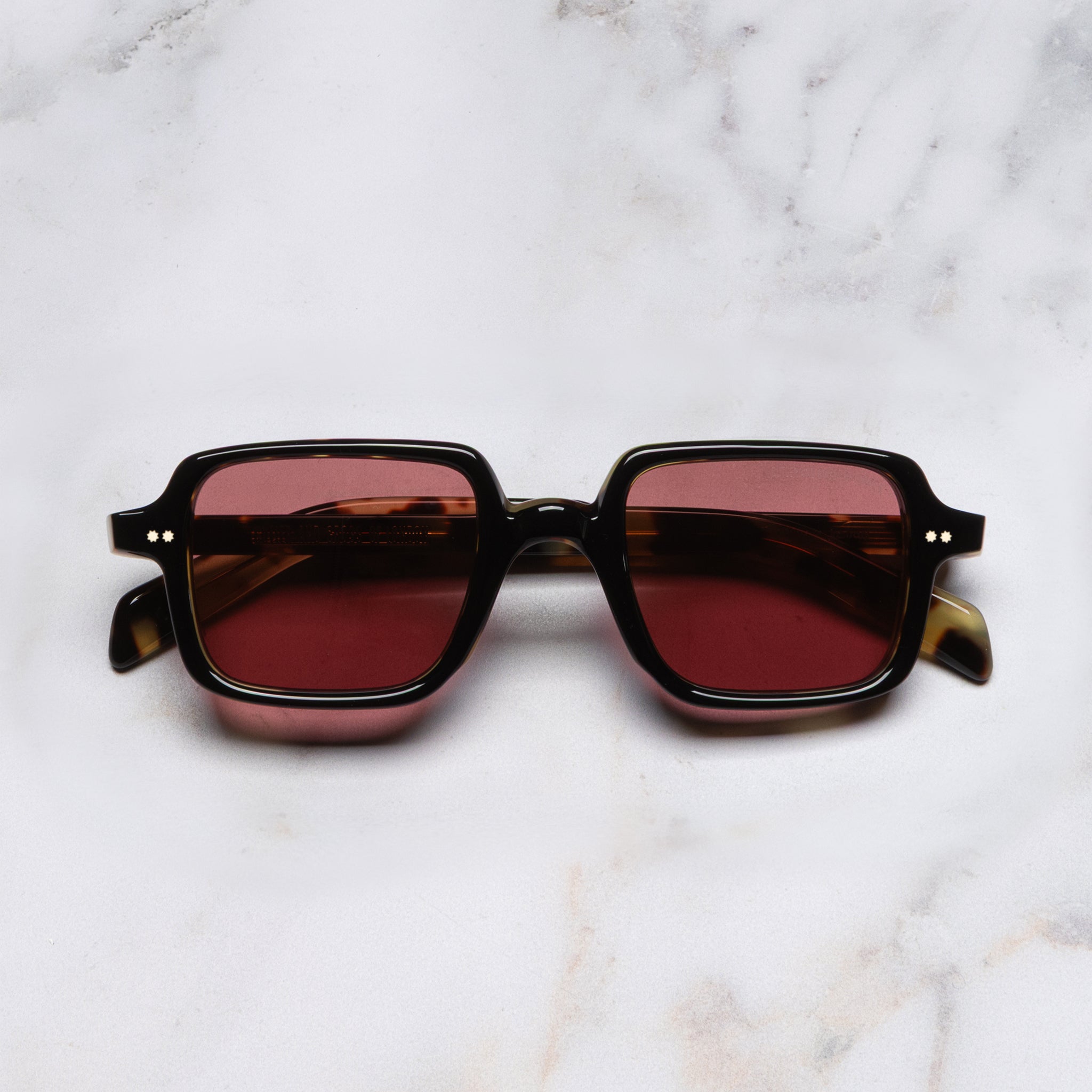 A pair of sunglasses shown from the front.