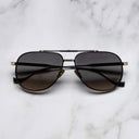 An image of the Sloane 1423 Aviator Sunglasses in Black/Gold frame frontal view with arms closed marble background