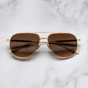 An image of the Sloane 1423 Aviator Sunglasses in Gold frame frontal view with arms closed marble background