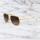 An image of the Sloane 1423 Aviator Sunglasses in Gold frame side view with arms open marble background
