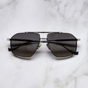 An image of the Kensington 1424 Aviator Sunglasses in Black/Gold frame frontal view with arms closed marble background