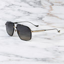 An image of the Kensington 1424 Aviator Sunglasses in Black/Gold frame side view with arms open marble background