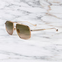 An image of the Kensington 1424 Aviator Sunglasses in Jewel Gold/Gun Metal frame side view with arms open marble background
