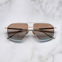 An image of the Kensington 1424 Aviator Sunglasses in Silver/Gold frame frontal view with arms closed marble background