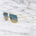 An image of the Kensington 1424 Aviator Sunglasses in Gold frame side view with arms open marble background