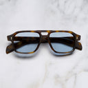 An image of the GR15 Aviator Sunglasses in Havana frame frontal view with arms closed marble background