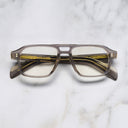 An image of the GR15 Aviator Opticals in Grey on Granny Chic frame frontal view with arms closed marble background