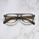 An image of the GR14 Aviator Opticals in Grey on Granny Chic frame frontal view with arms closed marble background