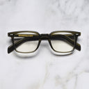 An image of the GR10 Square Opticals in Olive frame frontal view with arms closed marble background
