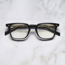 An image of the GR10 Square Opticals in Black frame frontal view with arms closed marble background