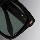 An image of the Breitling Limited-Edition Marisol 0005 Square Sunglasses in 18K Red Gold-plated frame detail close up of left lens.