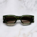 An image of the The Great Frog Soaring Eagle Rectangle Sunglasses in Leaf Green frame frontal view with arms closed marble background 