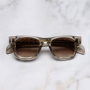 An image of the The Great Frog Phantom Square Sunglasses in Crystal Sand frame frontal view with arms closed marble background 