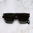 An image of the The Great Frog Titan Square Sunglasses in Black on Red frame frontal view with arms closed marble background 