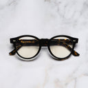An image of the 1378 Blue Light Filter Optical Round Glasses (Small) in Black on Havana frame frontal view with arms closed marble background 