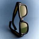 A clickable  image titled as Men's Sunglasses featuring black sunglasses with yellow lenses  and  Shop all button in the bottom left corner, all linking directly to Men's Sunglasses collection page. 