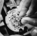 Black and white image of the craftsmanship on a watch.
