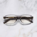 An image of the 0847 Kingsman Optical Aviator Glasses in Smoke Quartz frame frontal view with arms closed marble background 