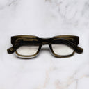 An image of the 0868 Kingsman Optical Square Glasses in Olive frame frontal view with arms closed marble background 
