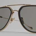 An 360 video of the Cutler and GrossThe Great Frog Limited-Edition Triumph Aviator Sunglasses in Gold/Black with arms open.
